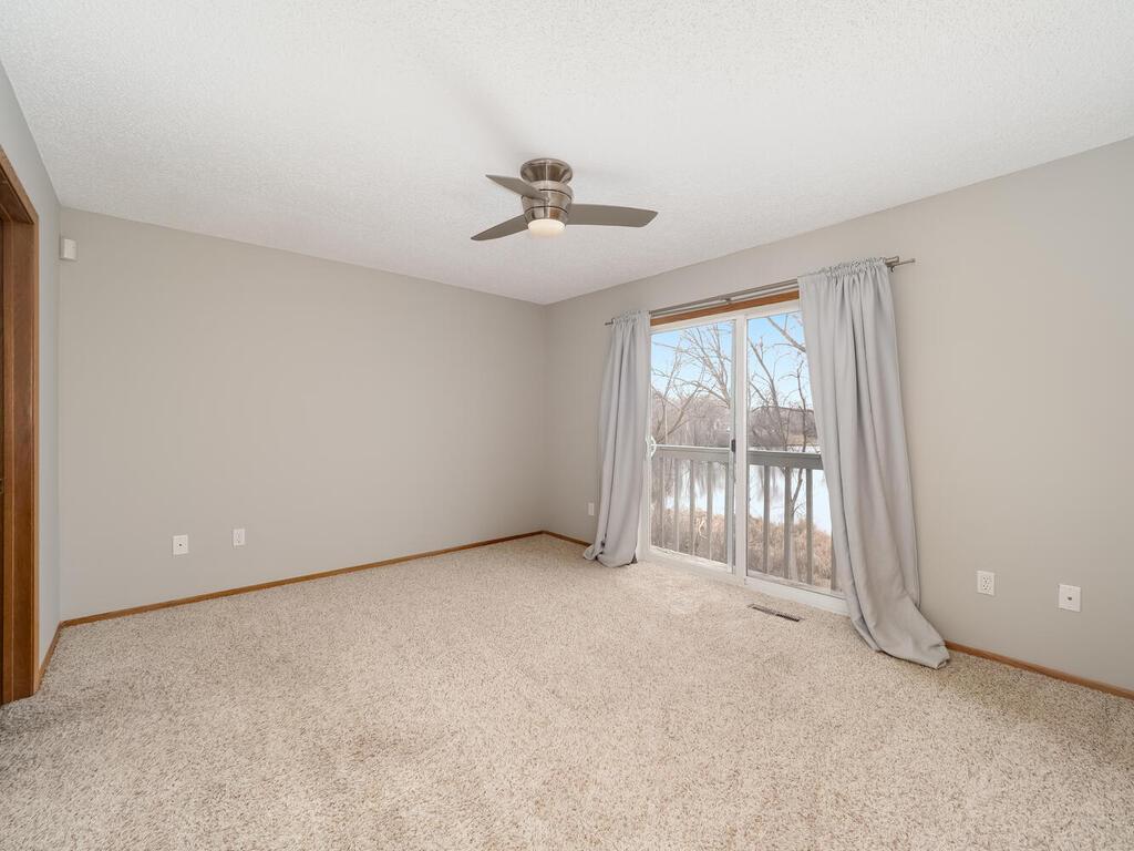 Desirable Primary Suite with personal deck overlooking Lemay Lake