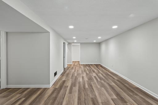 Recessed lighting and consistent flooring and paint throughout create a cohesive look, making this home truly move-in ready!