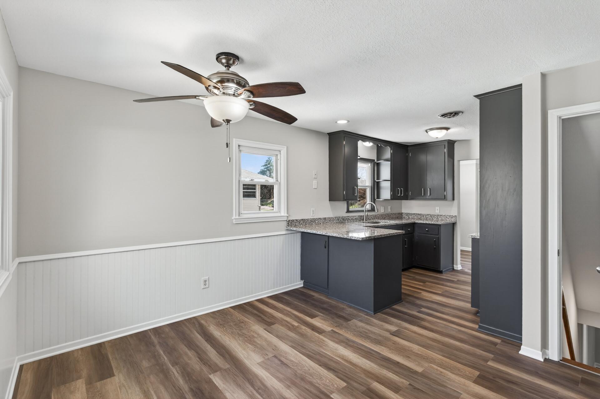 The breakfast bar offers additional casual seating while the dining area is ideal for formal meals.
