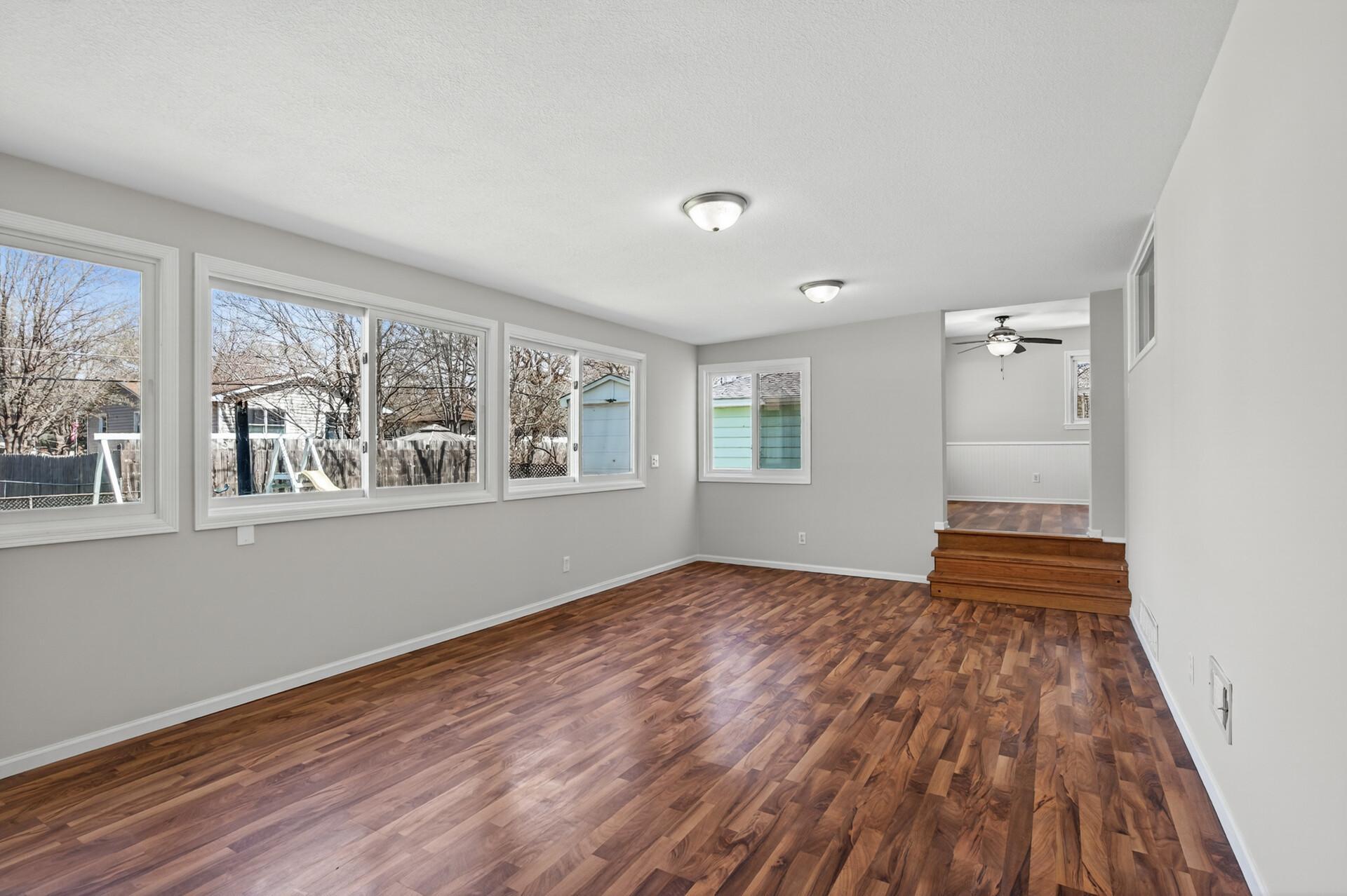 A wall of windows ensure this family room is bright and inviting.