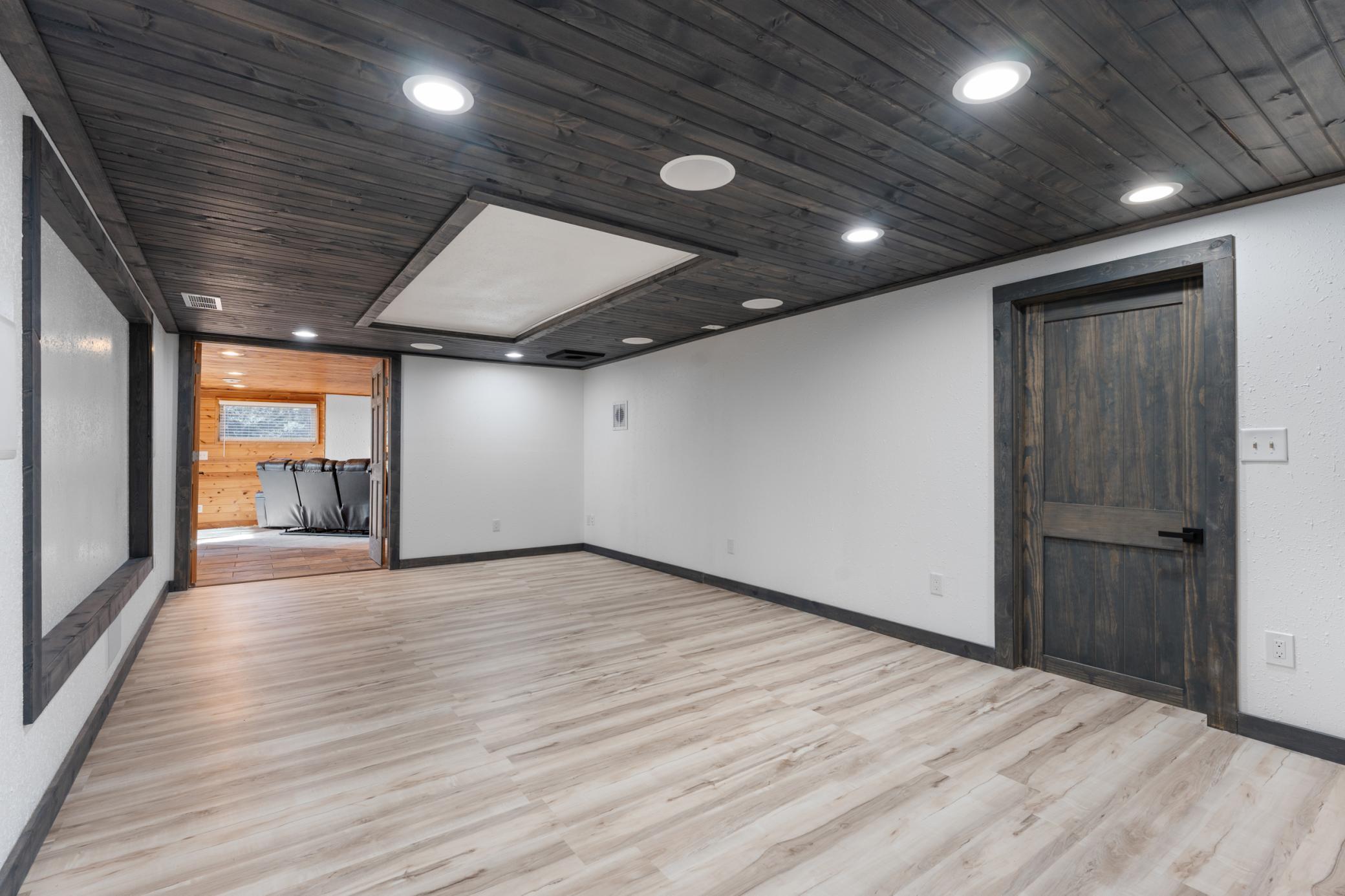 The lower level is an entertainer's dream complete with a theater room set up for a future projector and screen and features 7.2 built-in surround sound along with customizable strip lighting that syncs with your music.