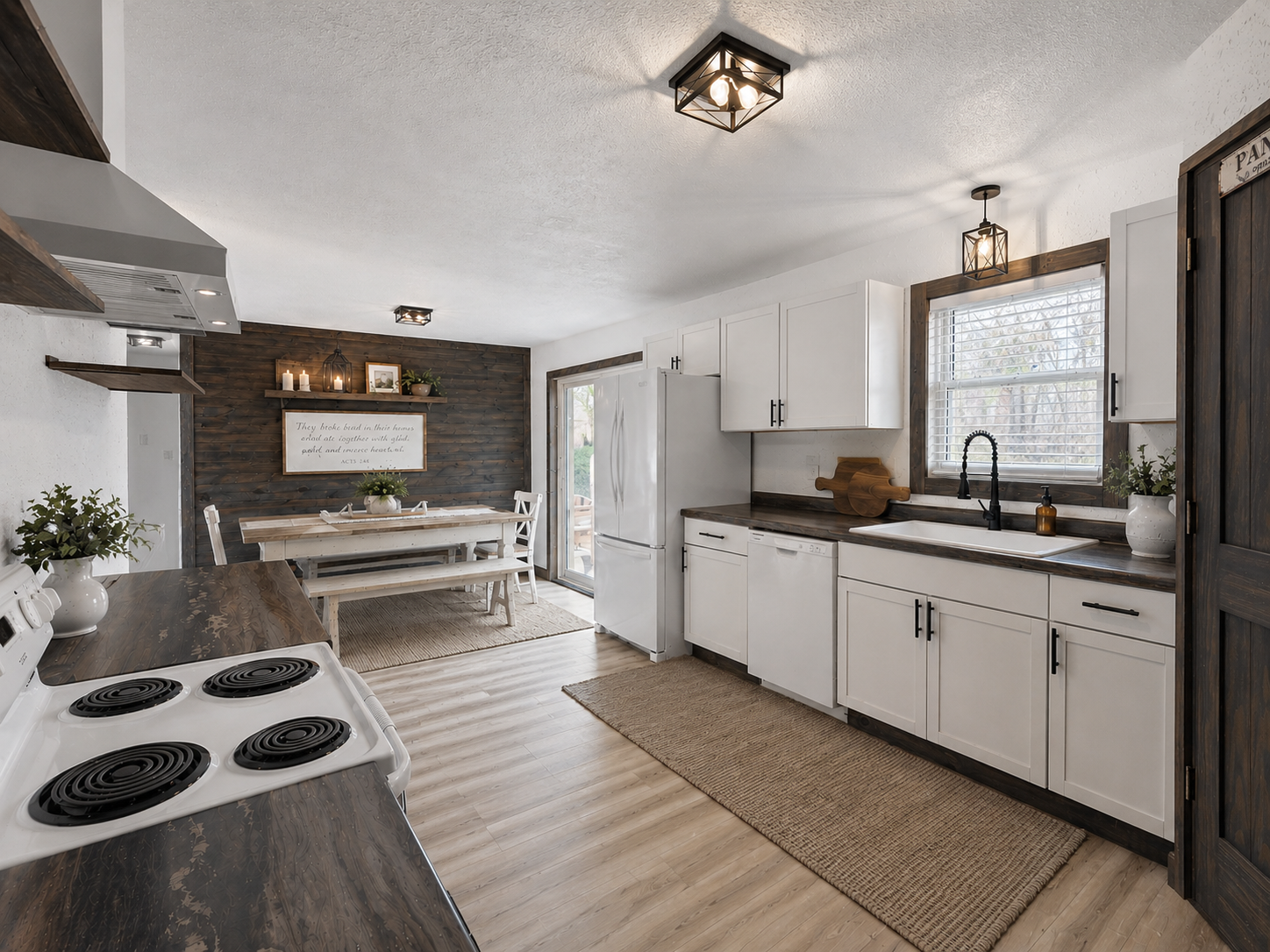 Rich wood accents throughout the home, including the stunning dining area wall, add character, texture, and rustic farmhouse charm. Image has been virtually staged.