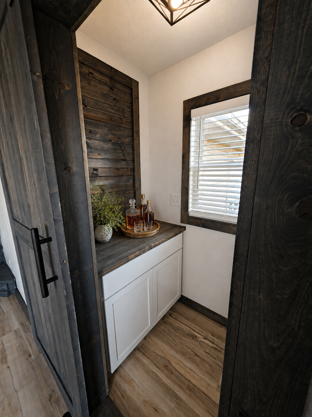 The versatile closet off the living room offers the perfect space for a cozy snack station, movie storage, or even a stylish bar setup to fit your lifestyle. Image has been virtually staged.