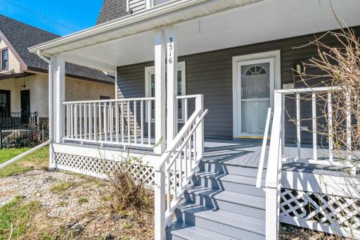 A spacious front porch is perfect for relaxing and enjoying the neighborhood.