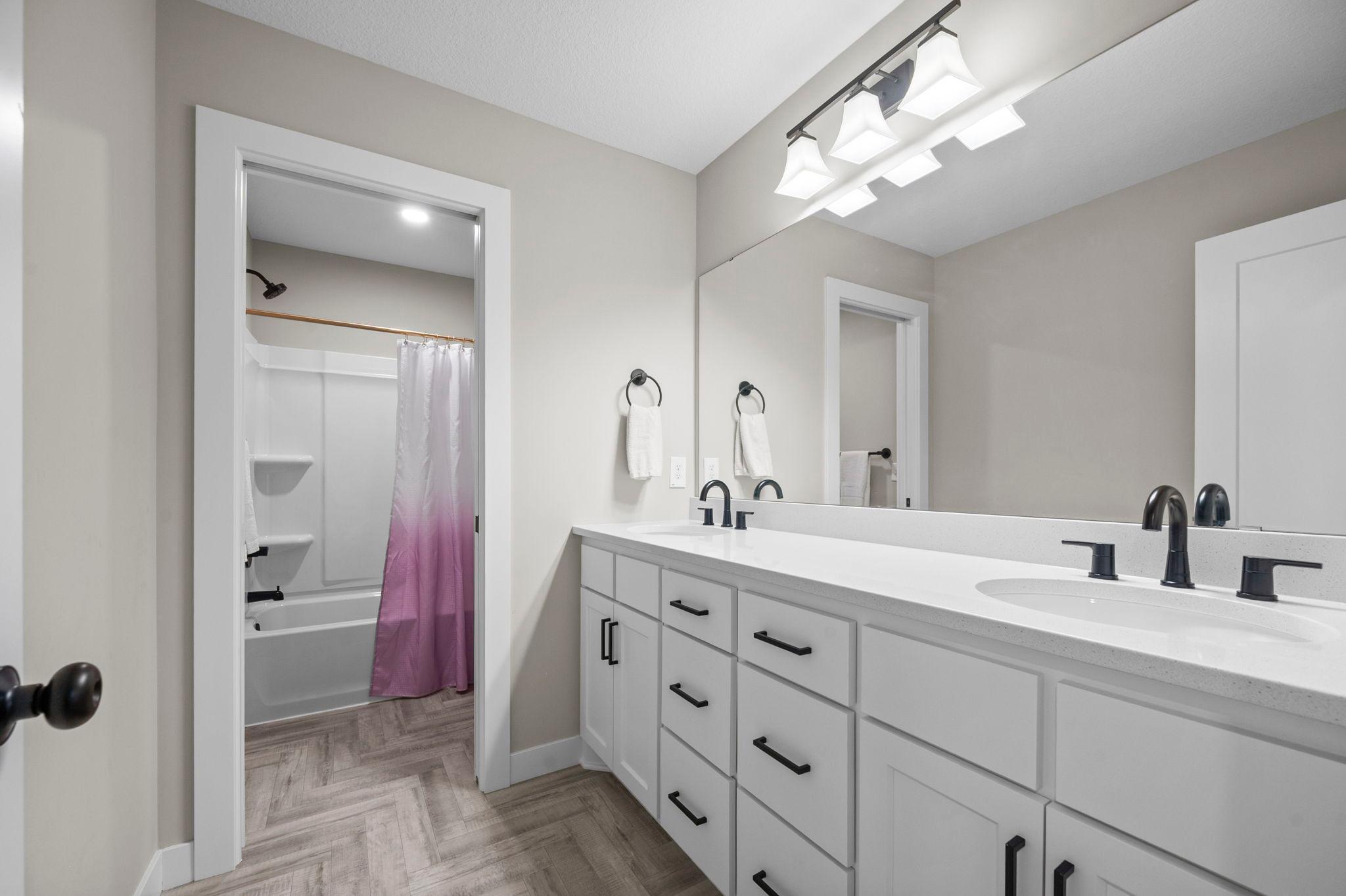 Upper level full bath with private stool/shower area.