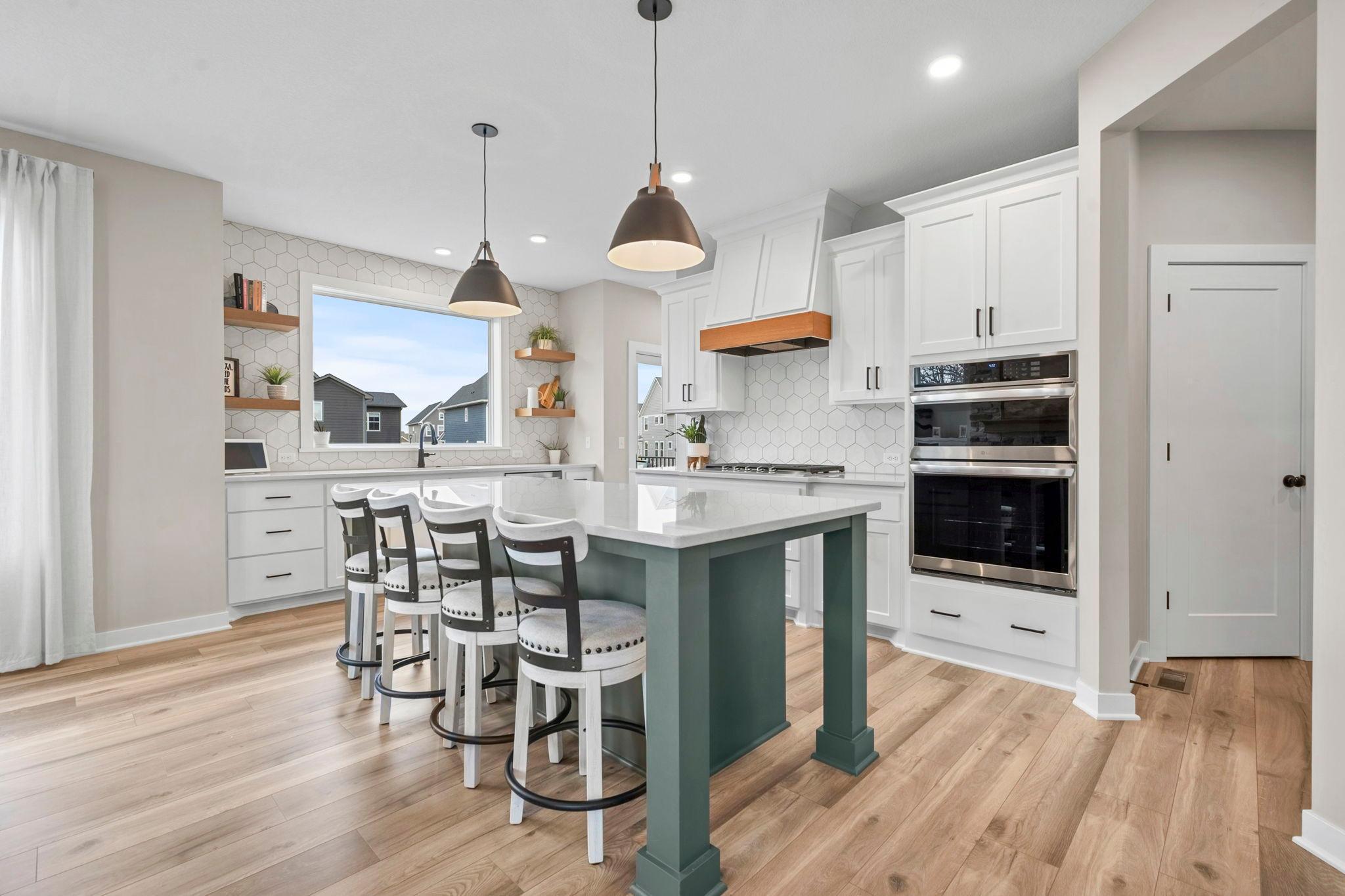 The island is a true centerpiece with the pop of color.