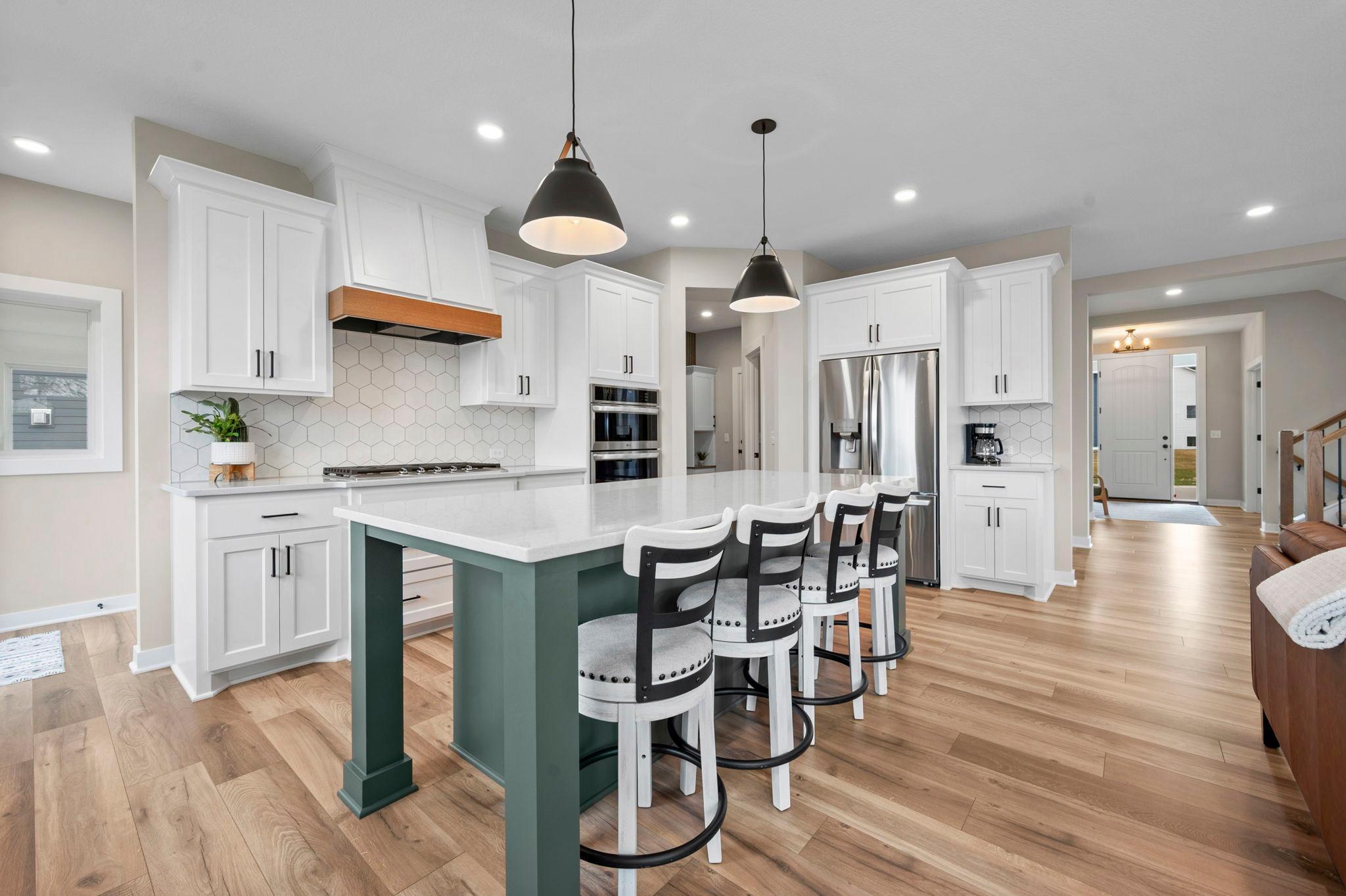 Additional seating at the island is perfect for quick meals and gathering while meal prepping.