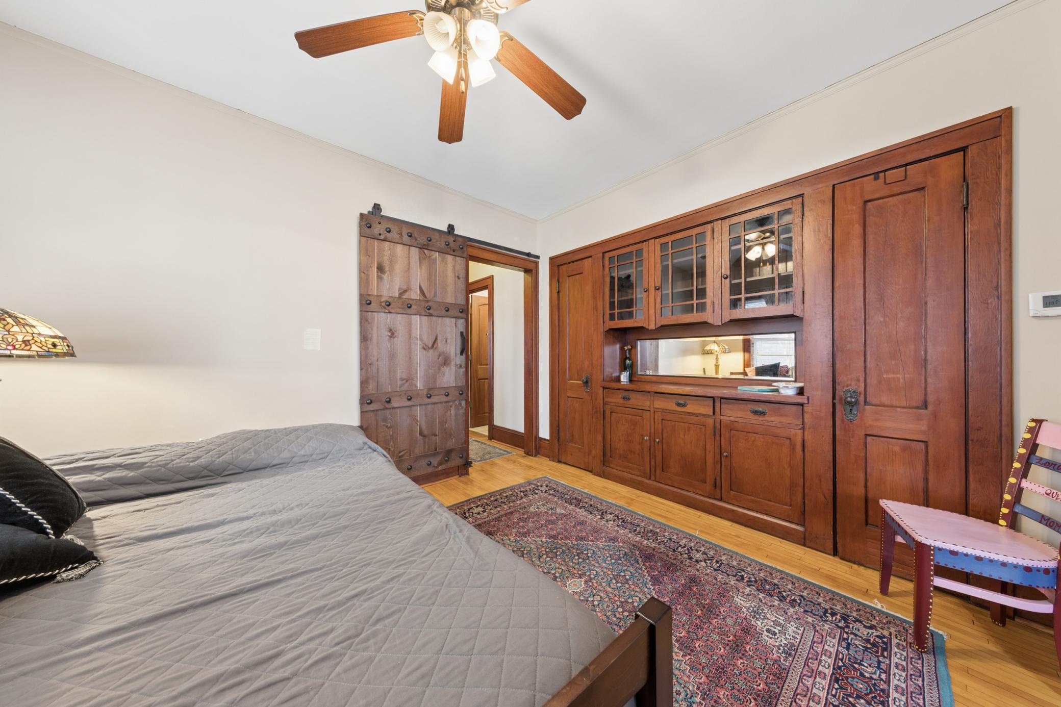 Character-filled formal dining room showcasing a timeless built-in buffet with glass-front uppers