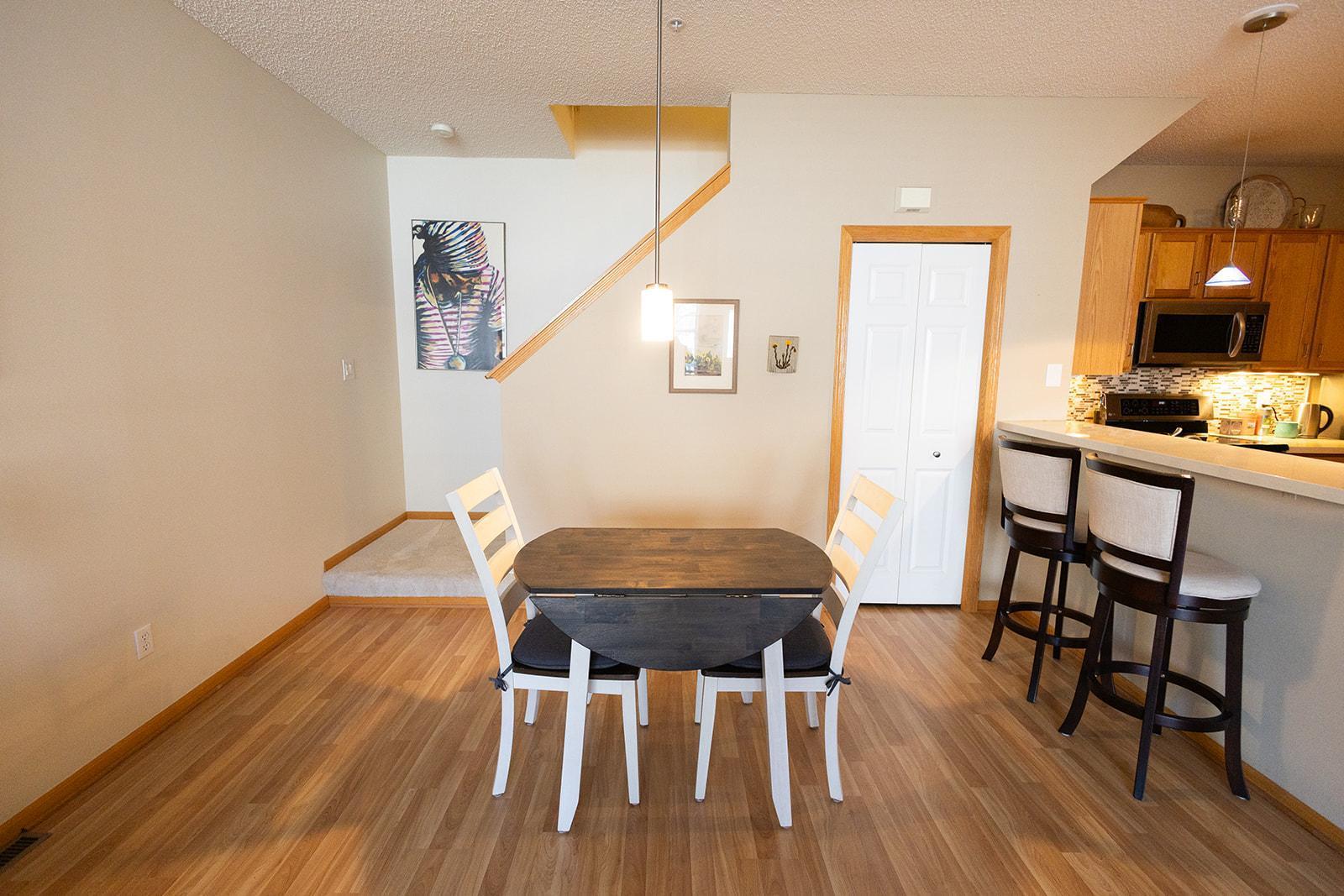 Dining area and extra seating at the breakfast bar.