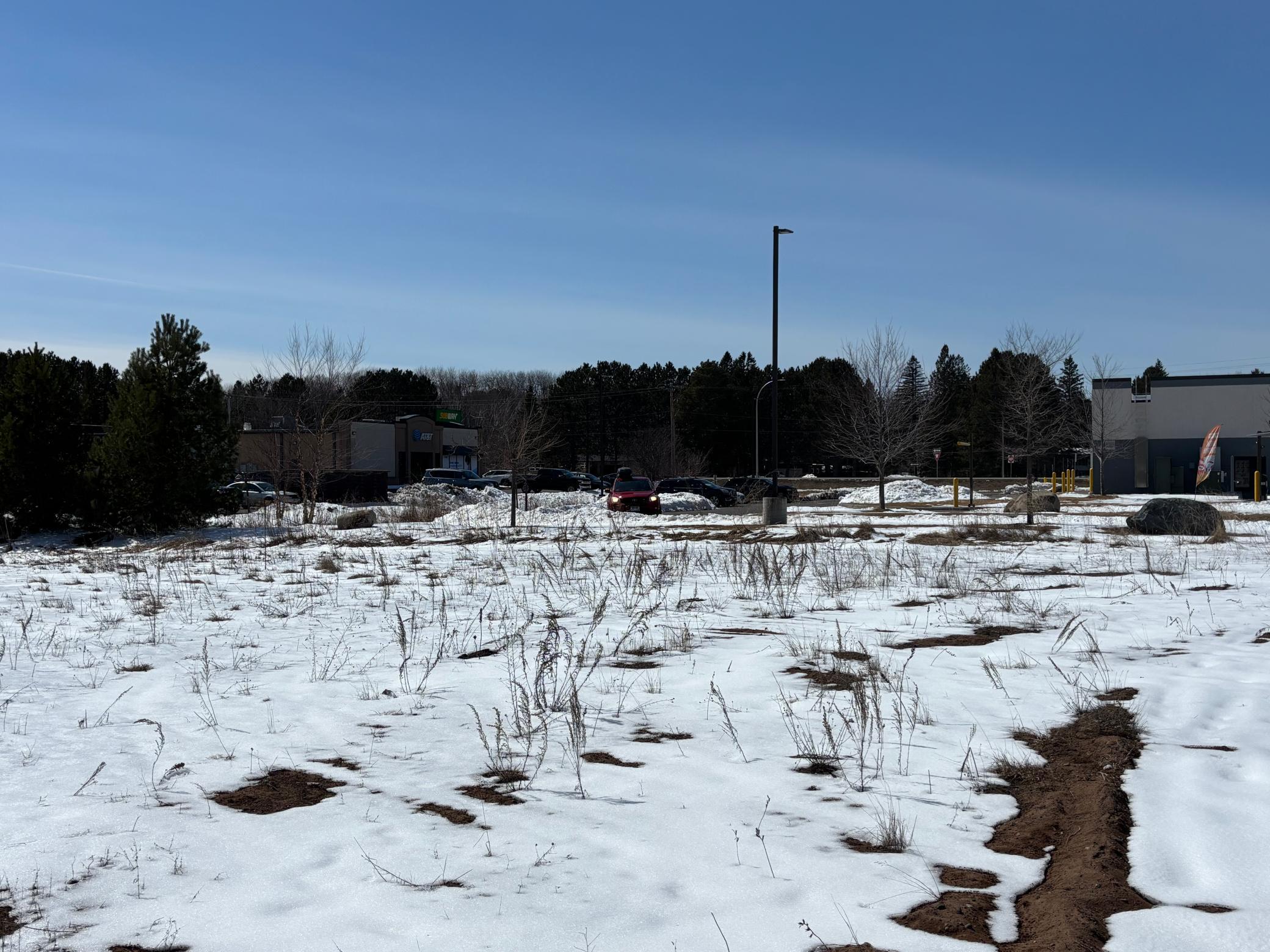 A view of the back of Taco Bell, AT&T and Subway.
