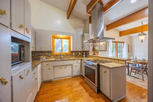 An open-concept layout connecting the living and dining areas to an updated kitchen.