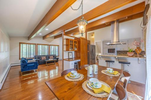 An open-concept layout connecting the living and dining areas to an updated kitchen.