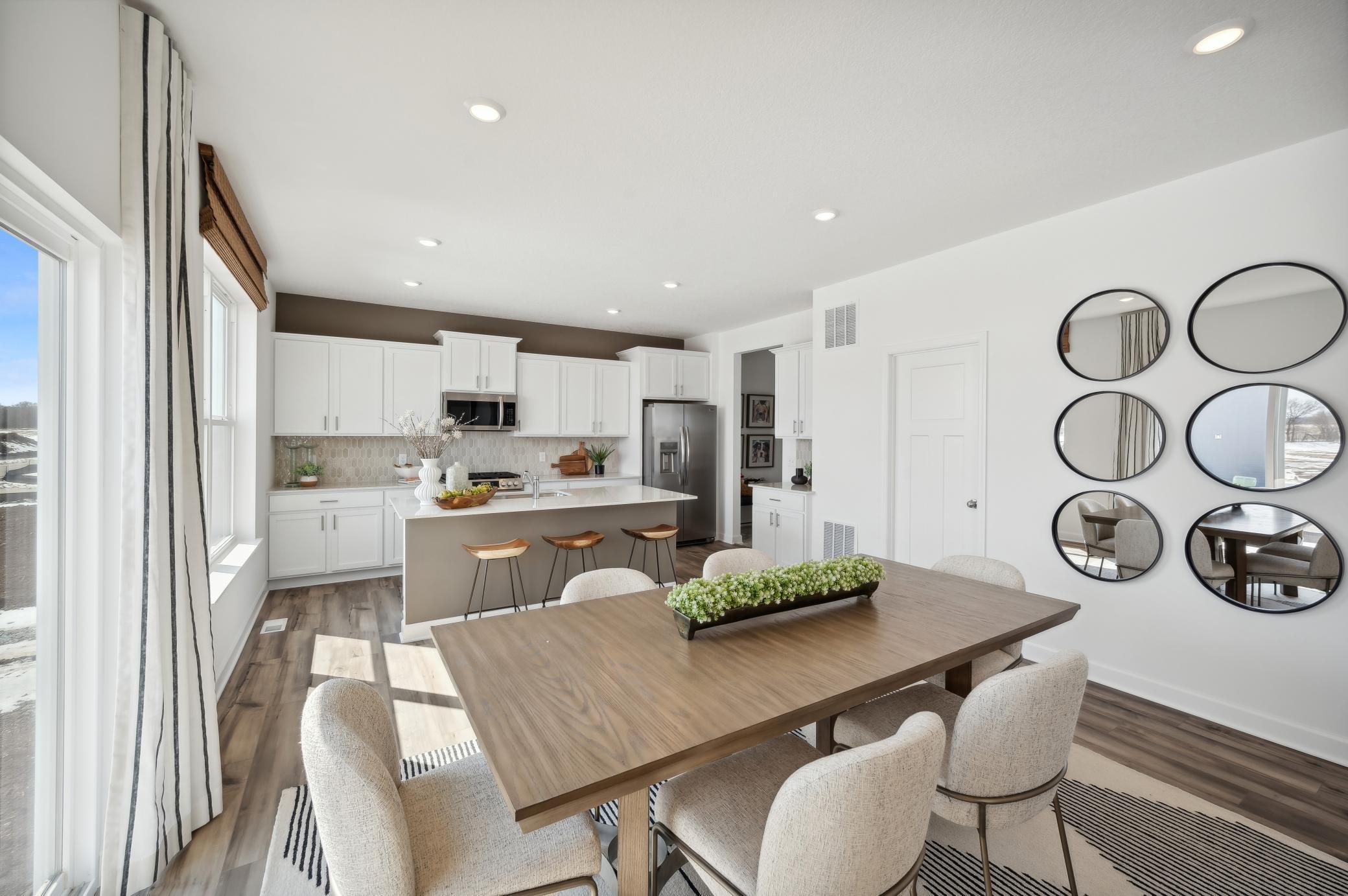 (Photo of model home, finishes will vary) Adjacent to the kitchen is a dinning area to enjoy meals with family and friends!