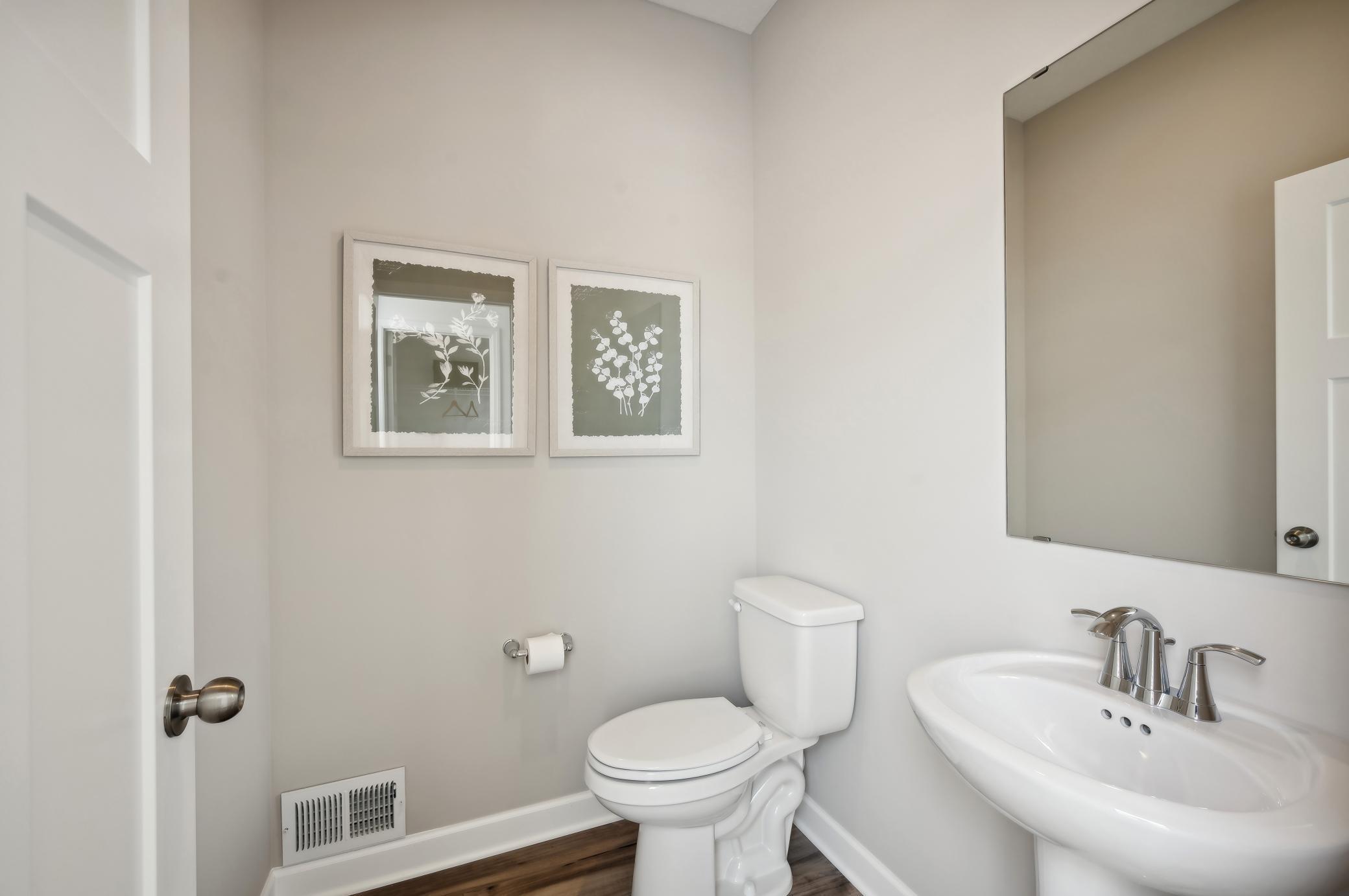 (Photo of model home, finishes will vary) Main level powder bath.