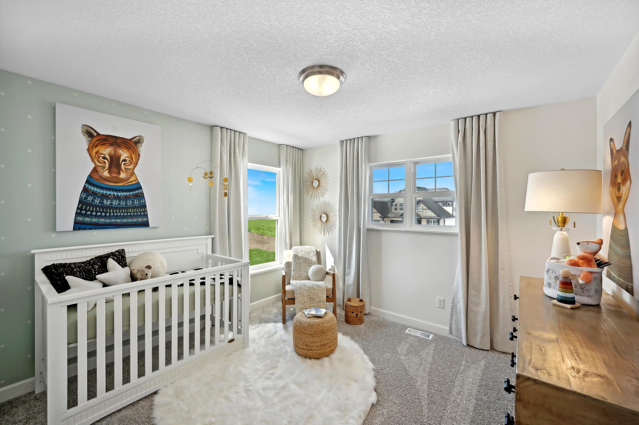 (Photo of model home, finishes will vary) All three secondary bedrooms come with a spacious closet!