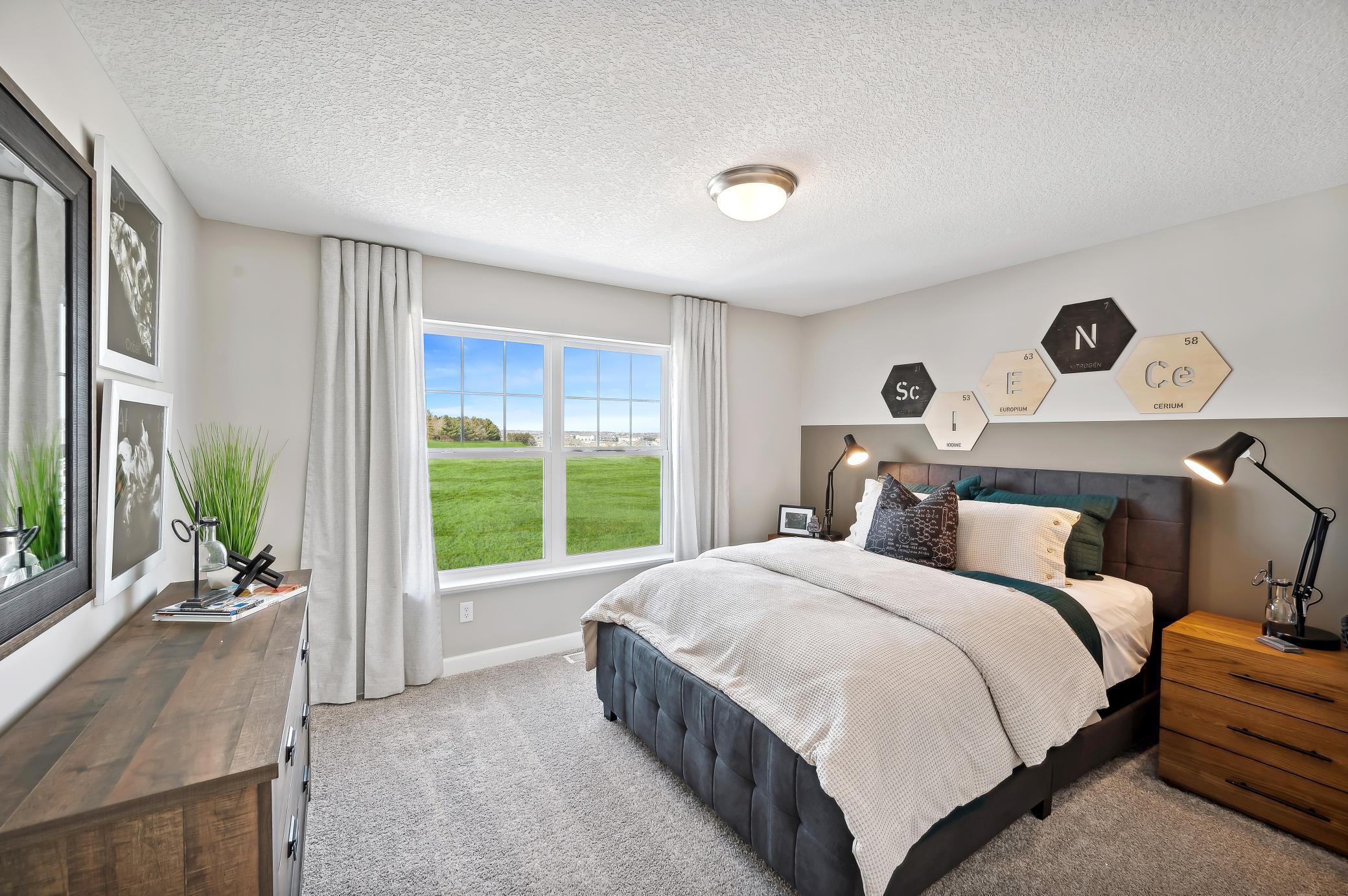 (Photo of model home, finishes will vary) All three secondary bedrooms come with a spacious closet!