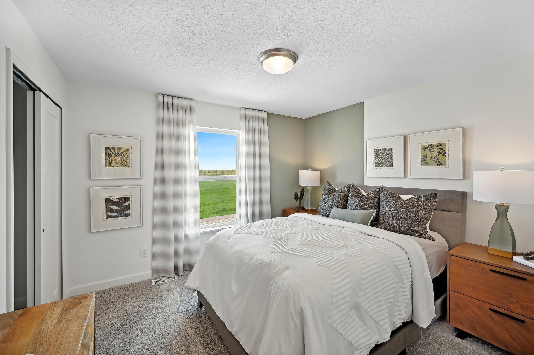 (Photo of model home, finishes will vary) All three secondary bedrooms come with a spacious closet!