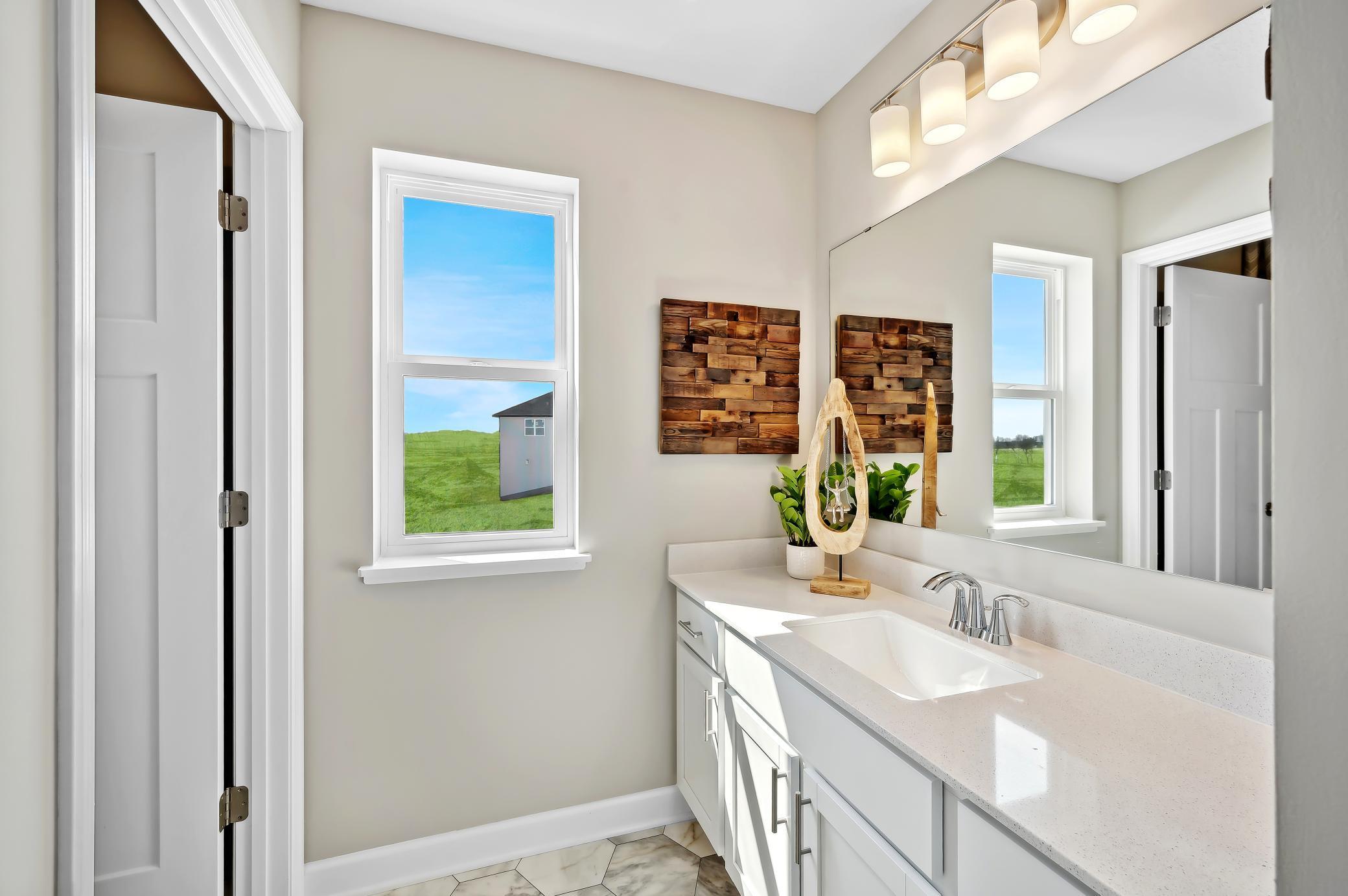 (Photo of model home, finishes will vary) The secondary bath!