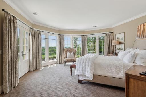 The lower-level bedroom retreat is a serene escape. Patio doors open directly to the pool deck, allowing for easy access to outdoor relaxation and entertaining. The seamless transition from the bedroom to the pool area enhances the overall appeal.