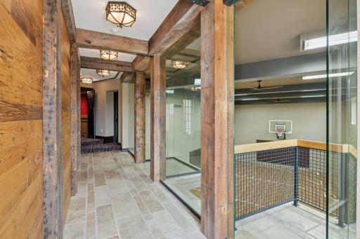 Hallway leading to the sport court, gym, and theater room.