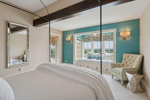 The 1st upper level bedroom's design harmonizes comfort and elegance. The window bench not only enhances the aesthetic but also provides a cozy nook that adds character to the room.