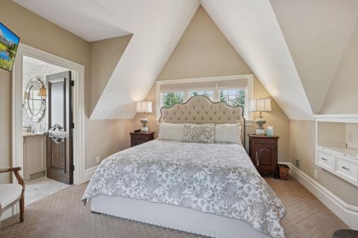 This 3rd bedroom retreat features a cozy sitting room, perfect for relaxation and conversation. This space is thoughtfully designed to offer comfort and privacy.