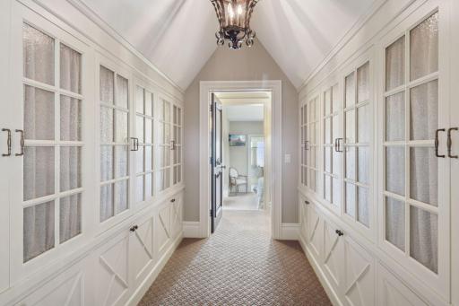 As you move down the hallway, custom built-ins line the walls.