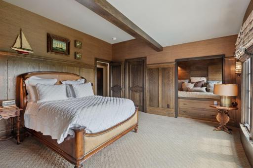 A built-in reading nook is the centerpiece of this bedroom.