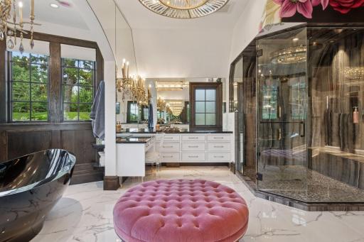 Enclosed in sleek glass, the huge walk-in steam shower is a true highlight of the bathroom, designed to transform your daily routine into a spa-like experience.