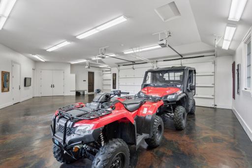 Enhancing the garage's functionality, there’s a dedicated dog washing station, making it easy to clean up after outdoor adventures. Additionally, another doggie door provides easy access to the outdoors.