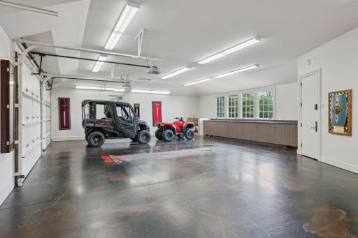 The massive attached three-car garage is a true dream for any car enthusiast or family in need of extra space. With ample room for vehicles, it also boasts tons of storage options.