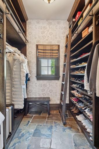 Featuring ample storage with built-in cabinetry and hooks, it provides a dedicated area for coats, bags, and shoes, keeping clutter at bay.