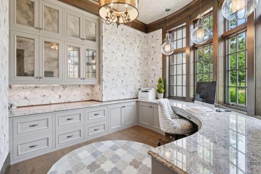 Adjacent to the kitchen is also the main floor office. Each room has been carefully designed to accent the new lighting and wall paper.