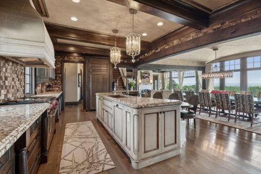 With not one, but two dishwashers, entertaining is effortless and cleanup a breeze. Stylish wine racks provide the perfect showcase for your collection. This space is not just a kitchen; it’s a gourmet experience waiting to happen.