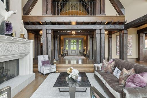 As you step inside, you’re greeted by the warmth of exposed wood beams overhead, adding character and depth to the spacious interior. Rustic elegance bringing the outside in.