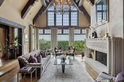 Expansive windows frame breathtaking views of the surrounding landscape, inviting natural light to flood the space. The scenery feels like a living painting, seamlessly blending the beauty of the outdoors with the charm of the interior.