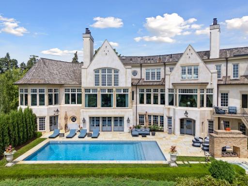 The pool deck is a stunning outdoor oasis, featuring a beautifully designed paver patio that enhances the space’s elegance and functionality. At the heart of the patio is an underground heated pool.