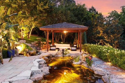 The outdoor covered patio is quipped with ceiling fans, heaters, and misting sprays. All overlooking the beautifully landscaped yard.