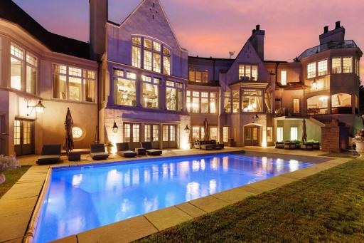 Multiple doors lead seamlessly from the lower level of the home to the pool deck, ensuring easy access and a smooth flow between indoor and outdoor living.