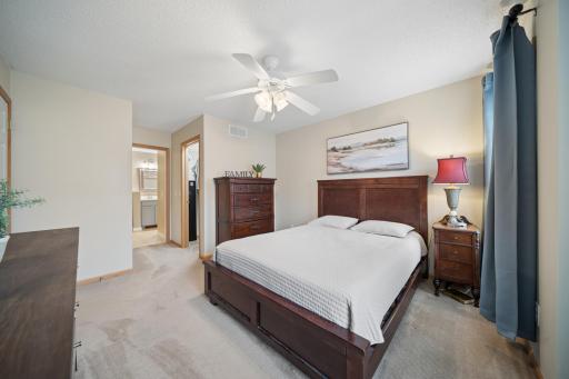 Primary bedroom with walk in closet and convenient access to the full bath
