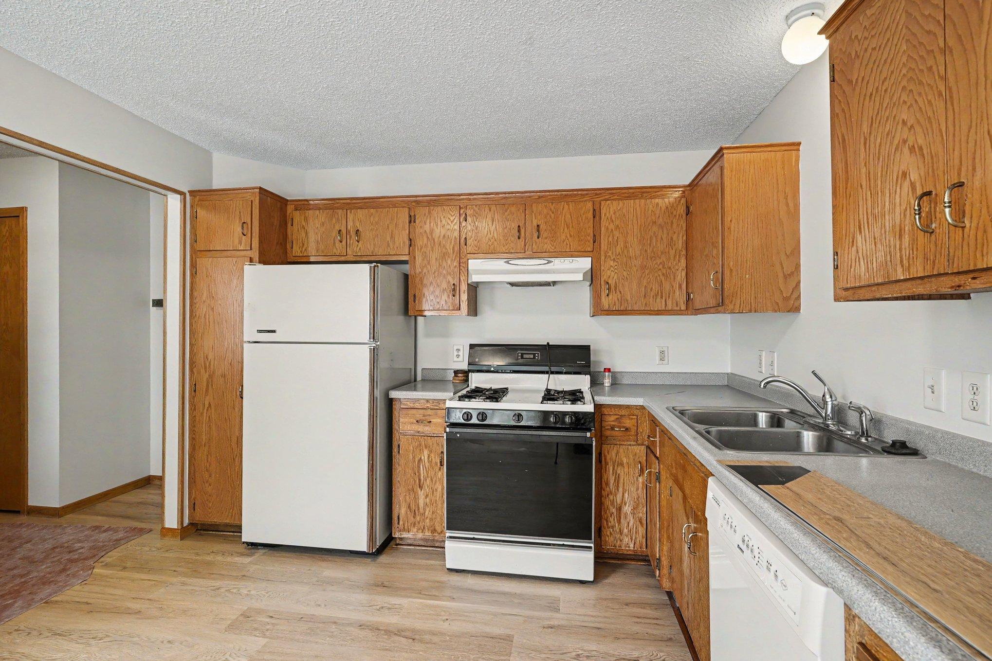 Kitchen appliance and counter view, updated flooring and fresh paint throughout (2026)