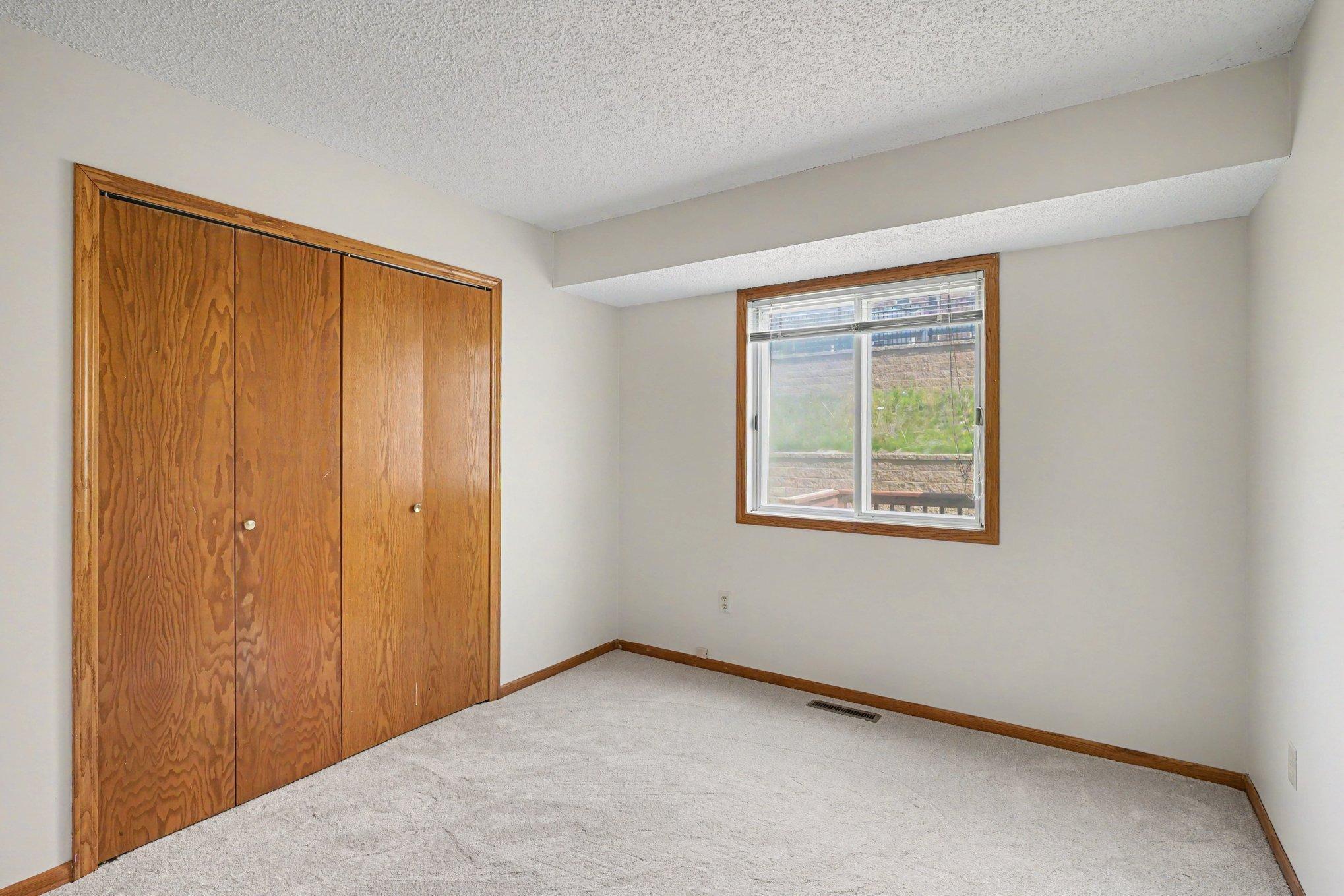 Second Bedroom shown unfurnished, natural light from the window