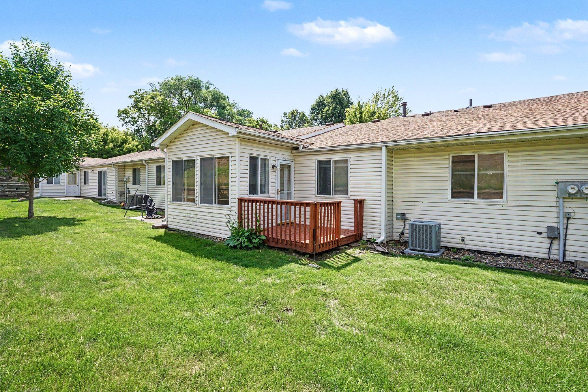Deck off the main living area, outdoor space for this one-level Apple Valley townhome
