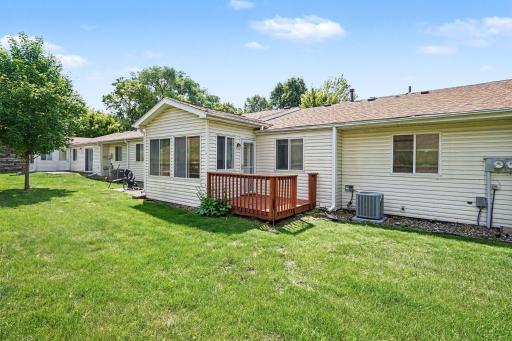 Deck off the main living area, outdoor space for this one-level Apple Valley townhome