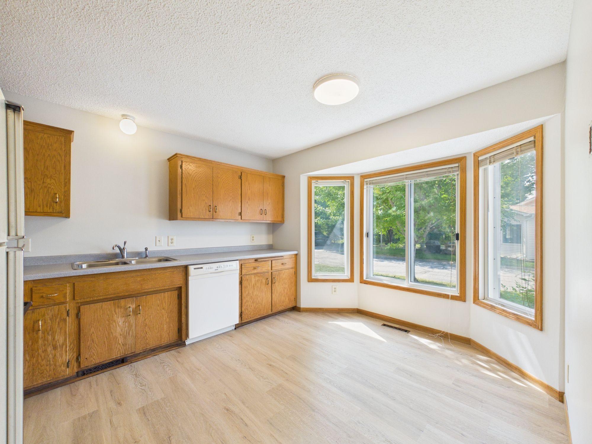 Kitchen bay window brings natural light into this Dakota County townhome kitchen
