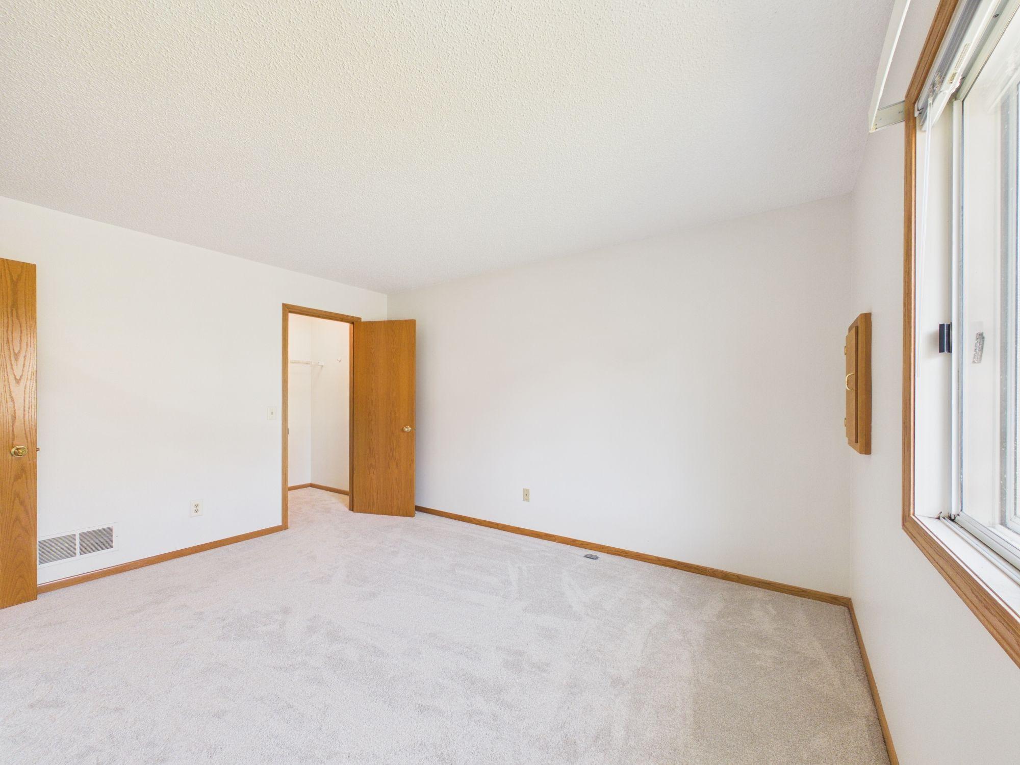 Primary bedroom shown unfurnished, true room dimensions