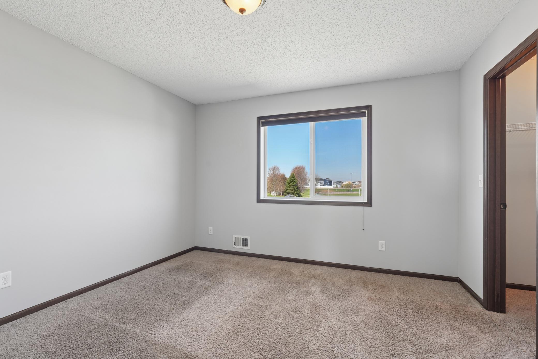 3rd upper level bedroom with walk-in closet
