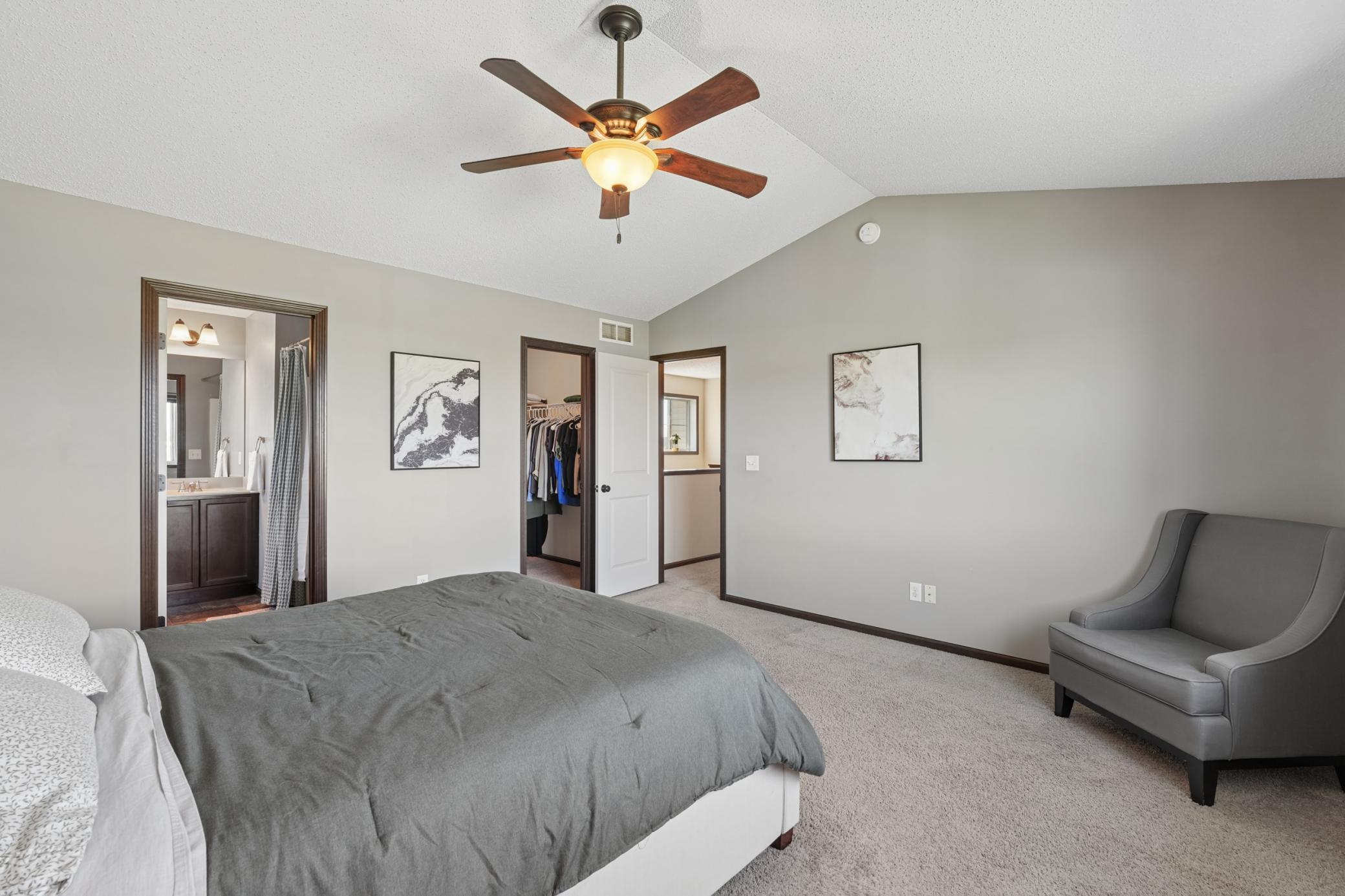 Primary bedroom with walk in closet and private en-suite bathroom