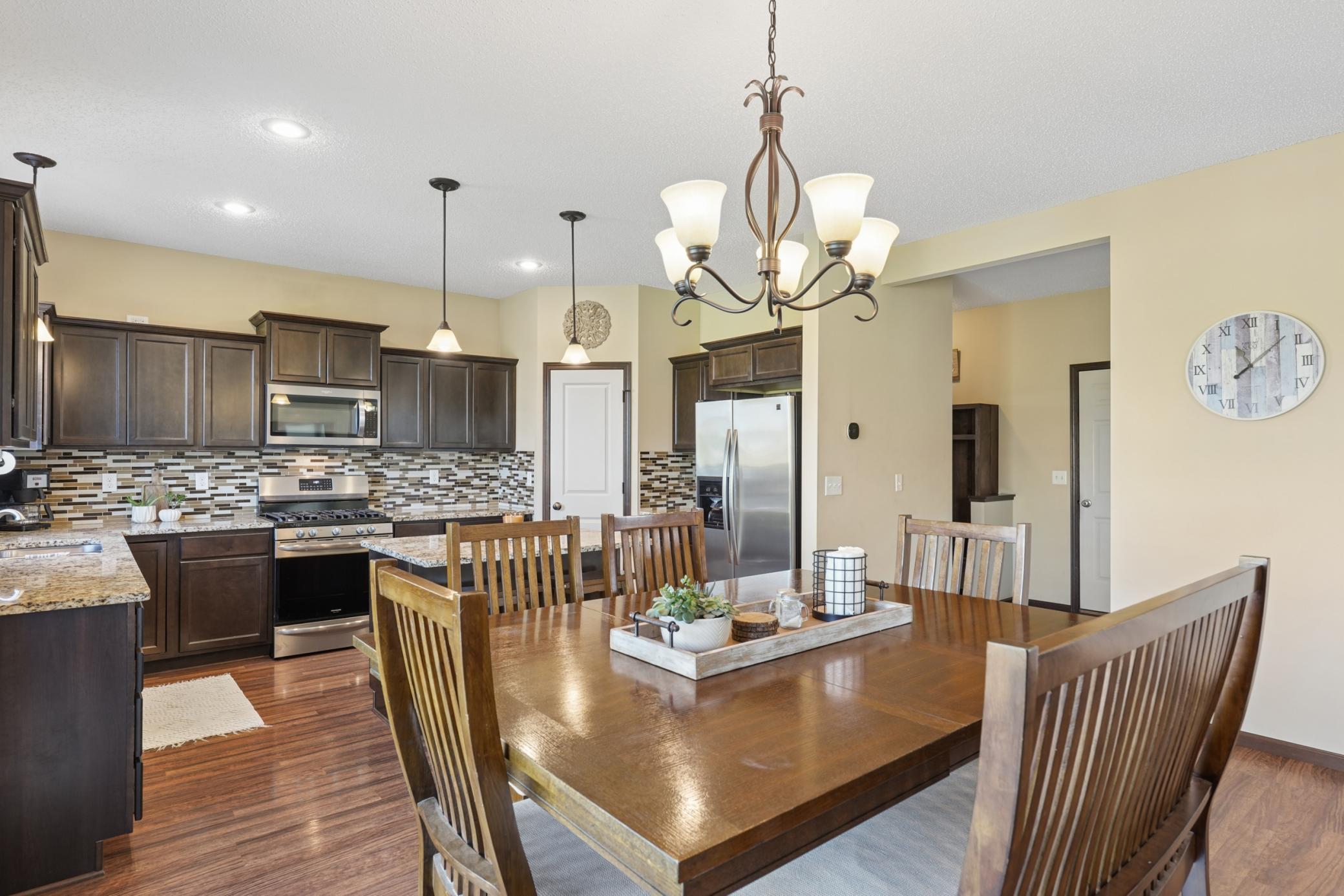 Enjoy cooking in this beautiful kitchen with granite countertops, tile backsplash, stainless steel appliances and walk in pantry