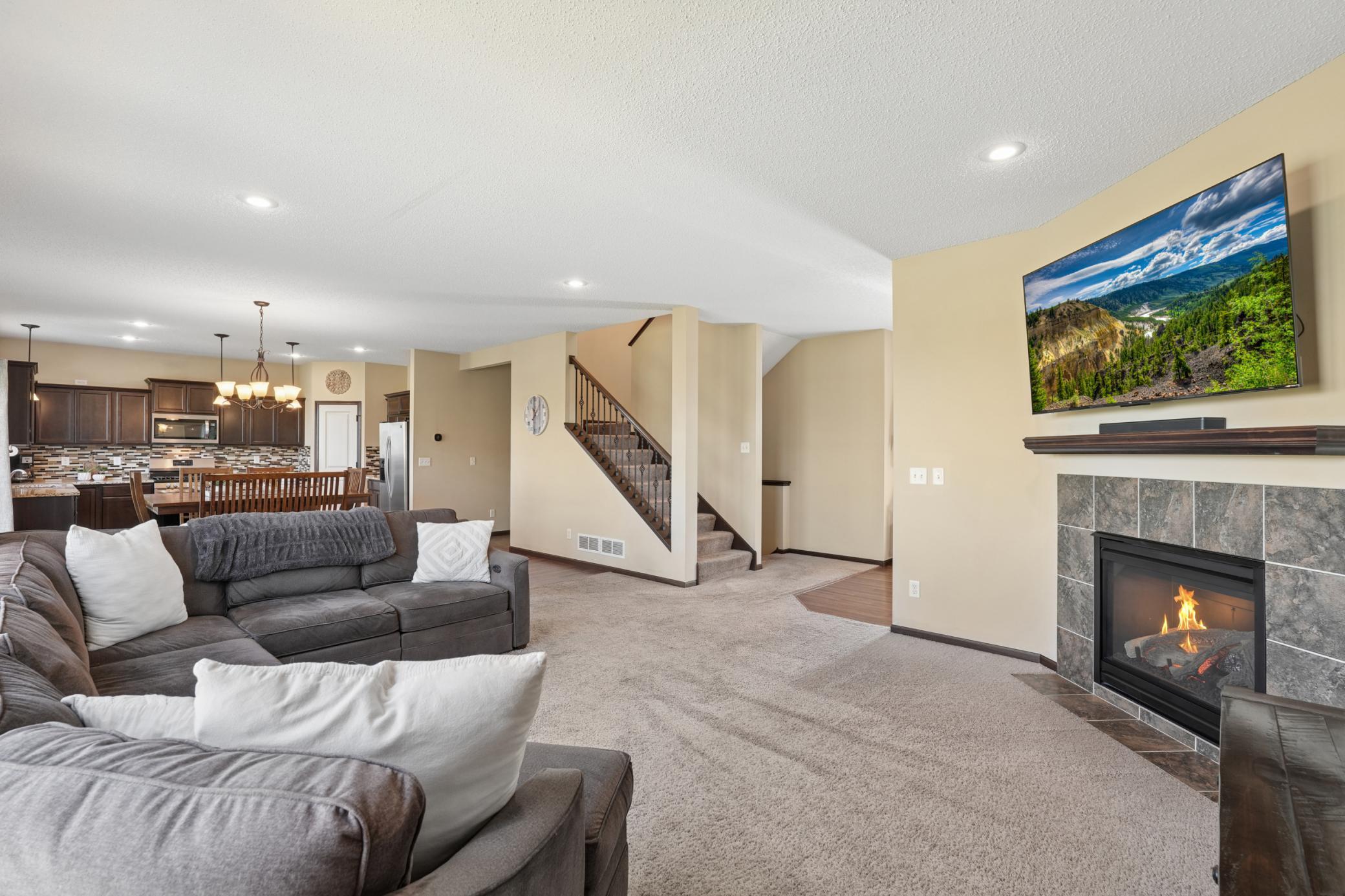 Open concept living that flows from the family room to the dining room and kitchen